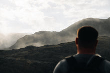 Load image into Gallery viewer, A man looking out to the mountains