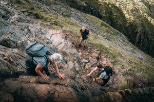 People scrambling up a section of Scafell Pike